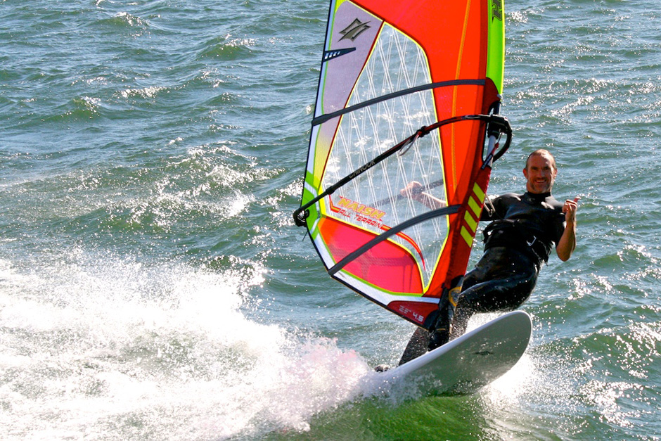 Joe windsurfing, giving us the shakka.